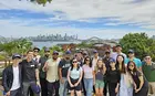 Sanat Khurana ’25 with other students with scenic background in Sydney
