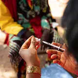A nurse preparing an injection